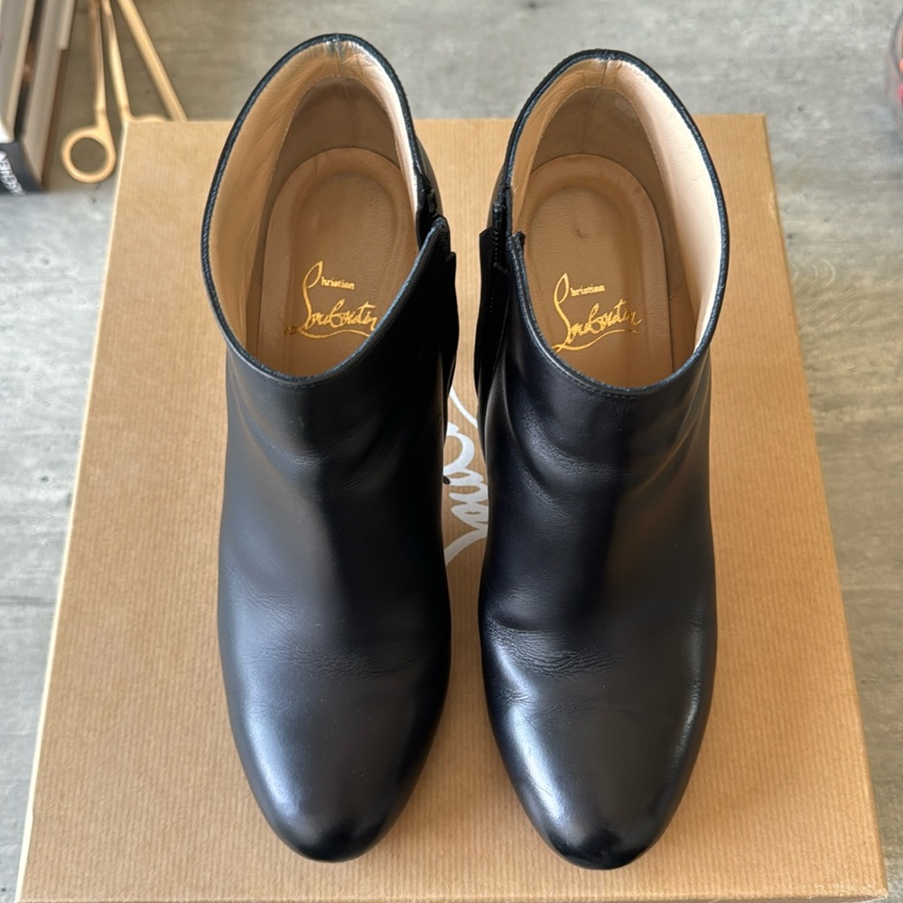 Authentic Christian Louboutin Belle black leather ankle with size zipper.